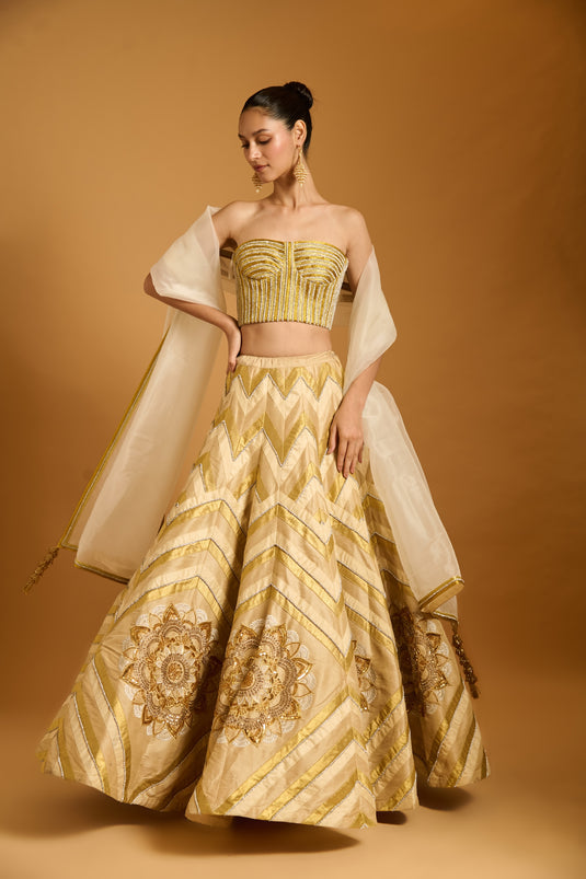 Trifecta cream-gold chevron lehenga